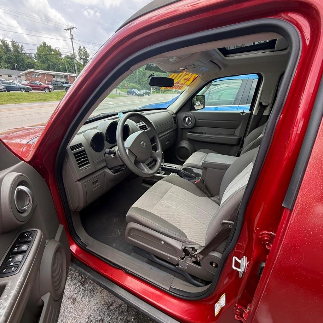 2008 RED DODGE NITRO SXT (1D8GU28K68W) with an 3.7L engine, Automatic transmission, located at 3338 US Rt. 60 East, Huntington, WV, 25705, (304) 733-9888, 38.411072, -82.379471 - Photo#4